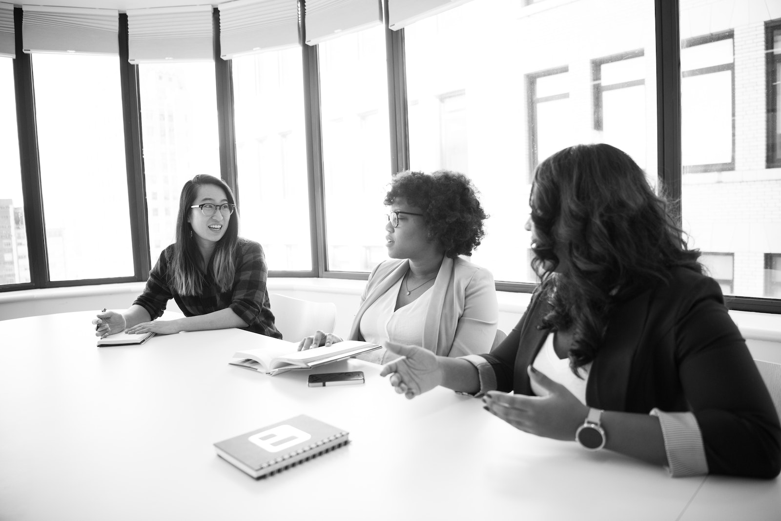 Grayscale Photography of Three Woman Inside Room